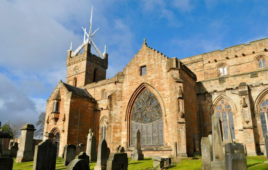 St Michael’s Church, Crown of Spires, Linlithgow A red stone traditional, medieval church with a graveyard and a much more modern, minimalist spire in mental